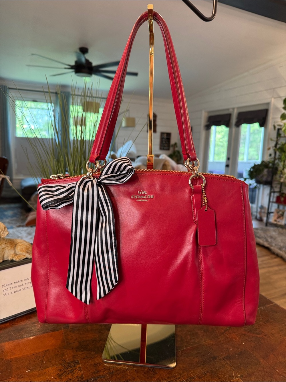 Coach Christie Carryall in a vibrant red